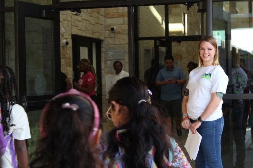 students walk into an elementary school