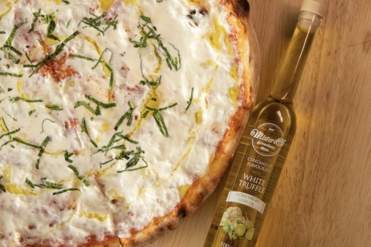 Picture of pizza and a condiment sauce