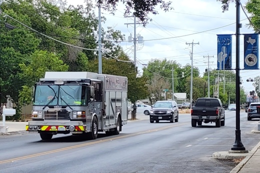 a street with a fire truck driving