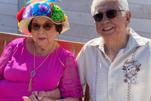two people sitting on a bench