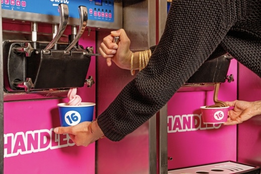 person getting frozen yogurt at 16 handles