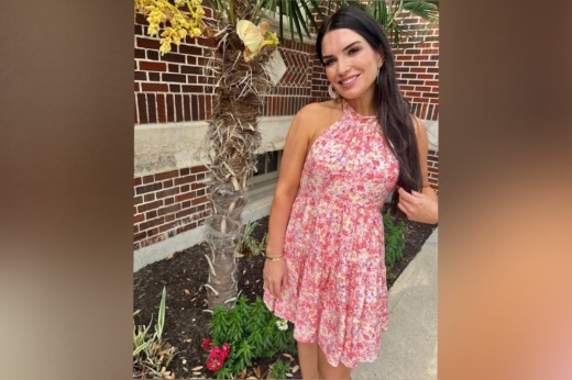 Chelsea Rogers models floral dress from her store.