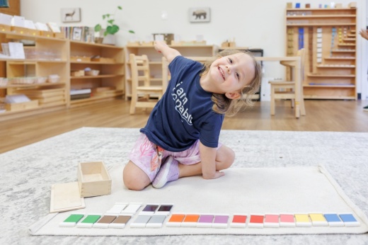 A child plays on a mat