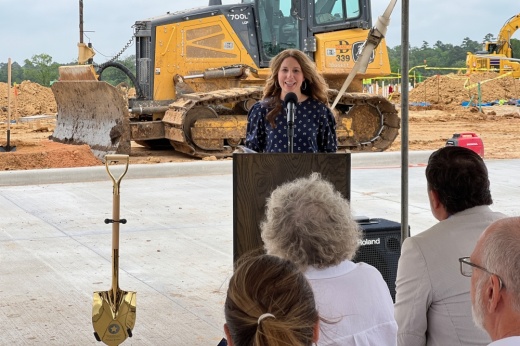 MISD board President Laurie Turner speaking career and technical education and agricultural science centers.