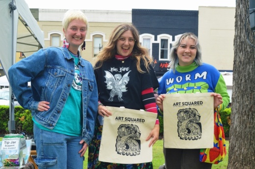 Art Squared Arts Market Director Karly Schilevert (left) stands with the program's 2023 tote bag design contest winners. (Courtesy San Marcos Art League)
