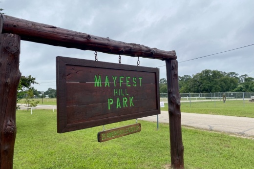 A sign reading Mayfest Hill Park