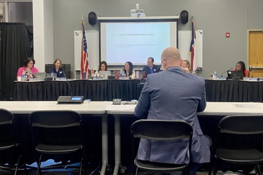 A man presents to the board of trustees