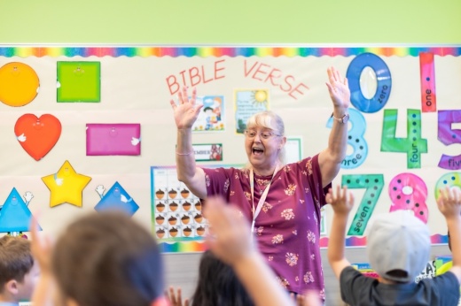 a teacher leads a preschool class
