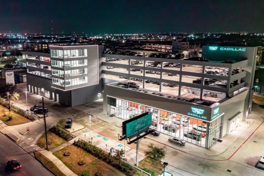 aerial view of a six-story car dealership at night