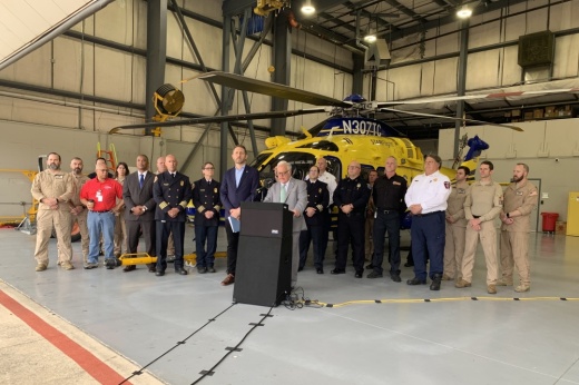 People lined up behind a podium