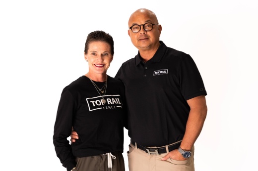 Male and female wearing black shirts with Top Rail Fence graphics.