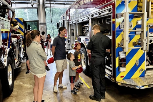 People gather in a fire station