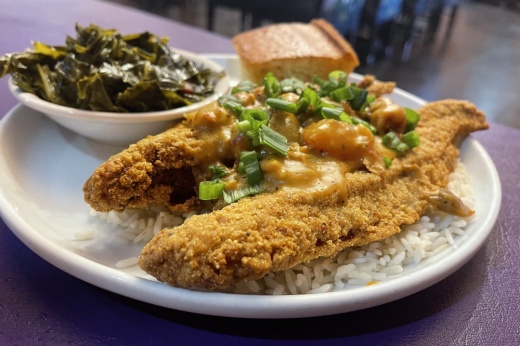 The fried catfish atchafalaya at Y'all's Down Home Cafe comes with two catfish fillets topped with crawfish étouffée over a bed of rice. (Grant Crawford/Community Impact)