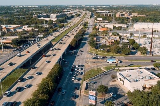 busy highway and frontage road drone shot
