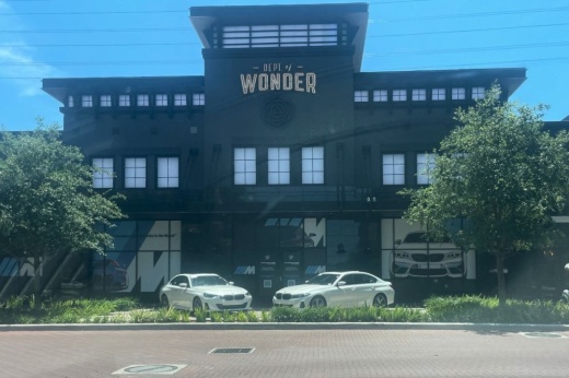 The Department of Wonder shuttered its doors at Sugar Land Town Square on Dec. 30. A new tenant for the space has yet to be selected, though signage for BMW sits in the windows of the venue for a May 18 food festival. (Amy Martinez/Community Impact)