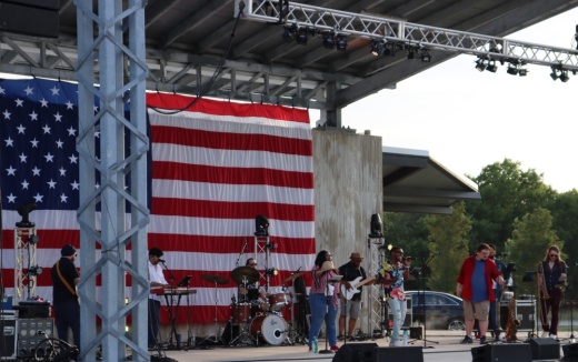 stage with an american flag backdrop