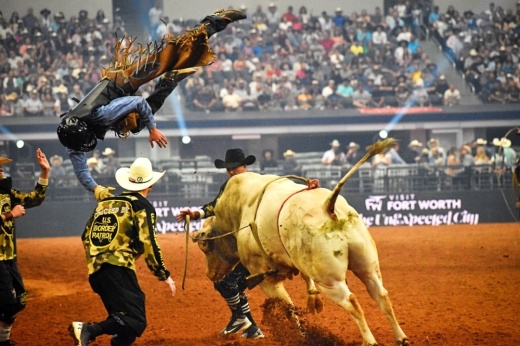 Bull rider goes high