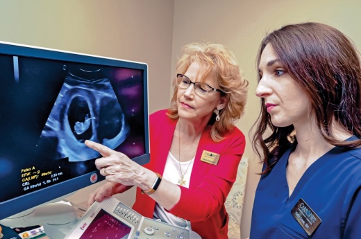 Two women looking at an ultrasound