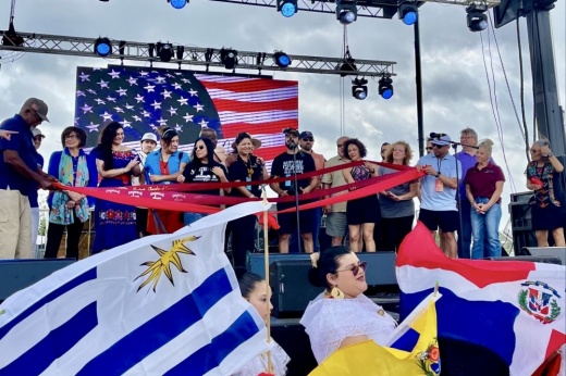 A group stands on a stage.
