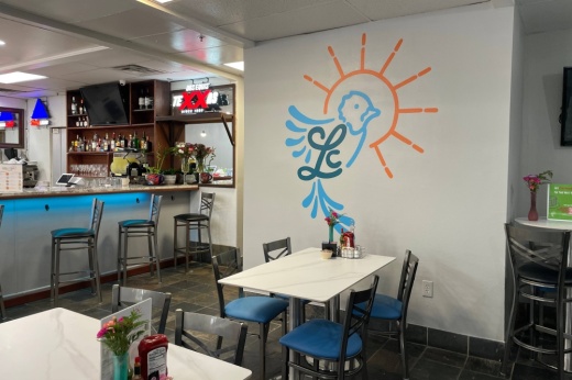 Interior of a restaurant with white and blue decor.