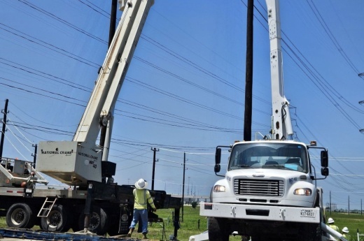 lineman working on poles