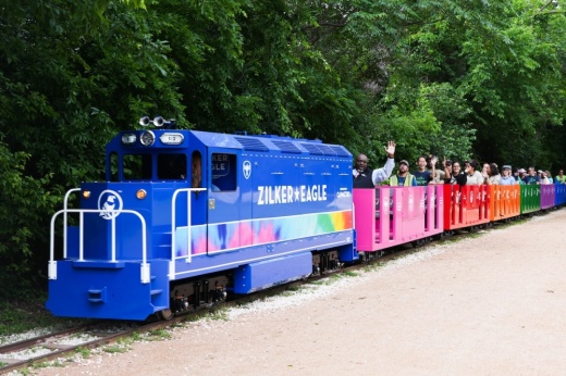 People taking a ride on the Zilker Eagle mini train