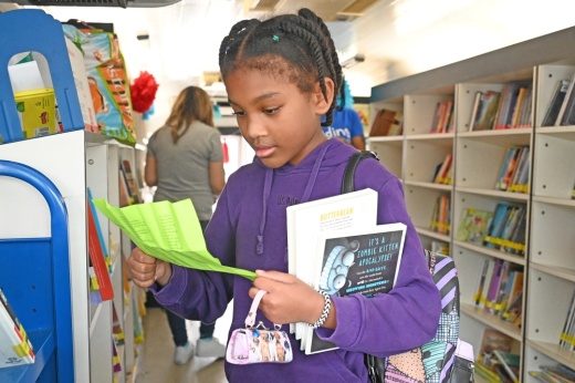 Students browse a mobile library in Cy-Fair ISD as part of Read Across America Day activities in March 2024.