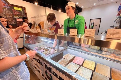 Customers look over ice cream options at Beth Marie's Old Fashioned Ice Cream during the Main Street Festival in Grapevine on May 17. (Cody Thorn/Community Impact)