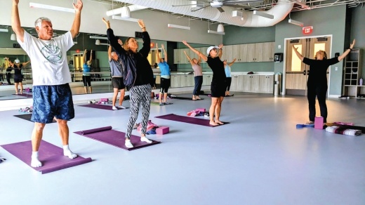 Group participating in yoga stretches