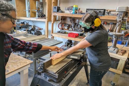 Members at Make at Rosie use woodworking tools for projects. (Courtesy Make at Rosie)