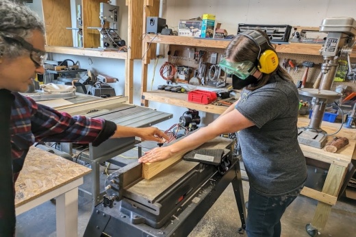 Members at Make at Rosie use woodworking tools for projects. (Courtesy Make at Rosie)