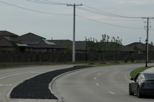 A car drives along Bothwell Boulevard in Celina