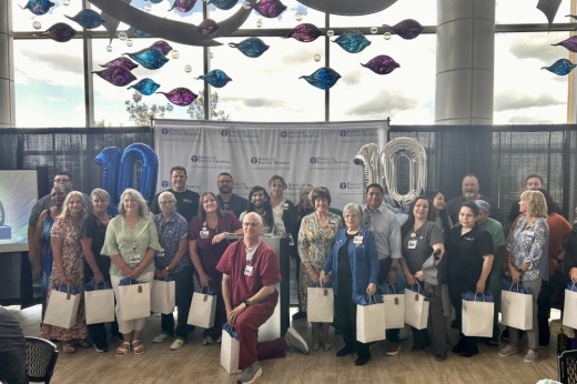Group photo of the original 45 employees of the hospital. (Shaheryar Khan/Community Impact)
