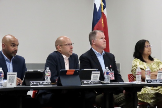 The Coppell ISD board of trustees in session
