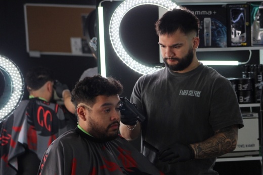 Christian Caballero cutting hair