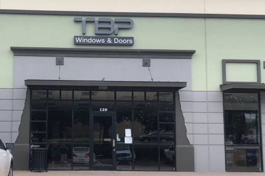 Building with TBP Windows & Doors signage.