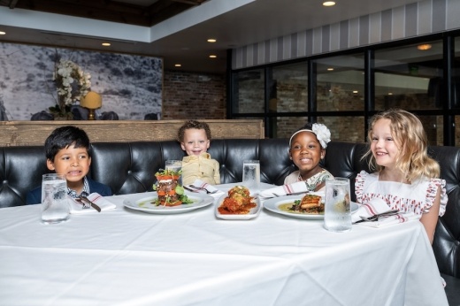Picture of four children at a dining table