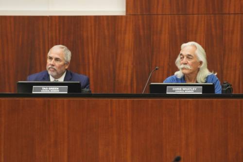 From left, Keller City Council members Tag Green and Chris Whatley listen during a presentation during the July 2 council meeting. (Cody Thorn/Community Impact)