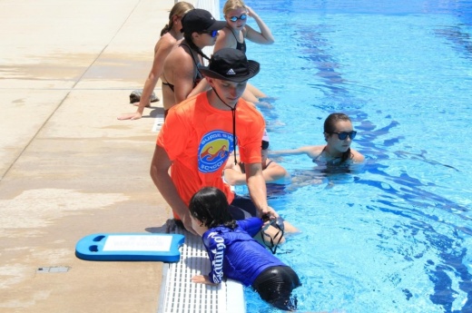 Image shows children swimming lessons.