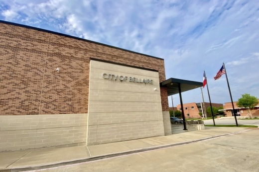 the exterior of a brick building with a city of bellaire sign on it