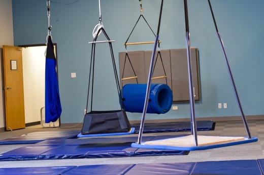 The inside of a gym with occupational therapy equipment