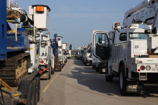 CenterPoint vehicles line up at a staging site near Katy.