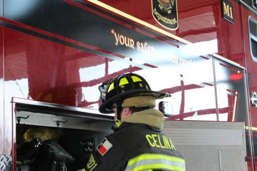 Firefighter and paramedic Taylor Wilson grabs something from an ambulance inside the bay of Celina Fire Station No. 1.