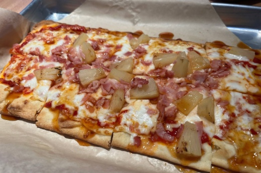 Flatbread pizza with ham, pineapple.