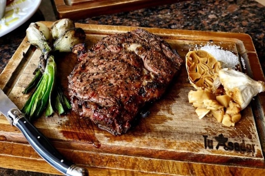 Photo shows a steak.