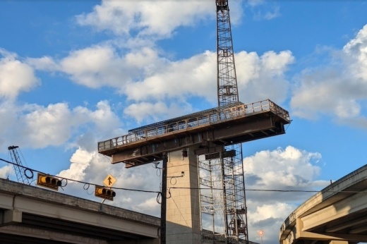 Construction crews work on a new bridge support at the I-10/Loop 1604 interchange, which is being overhauled as part of the Loop 1604 expansion in North San Antonio. (Edmond Ortiz/Community Impact)