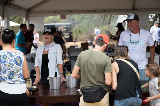 woman offering wine samples