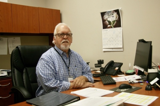 The mayor poses behind his desk in June of 2023.