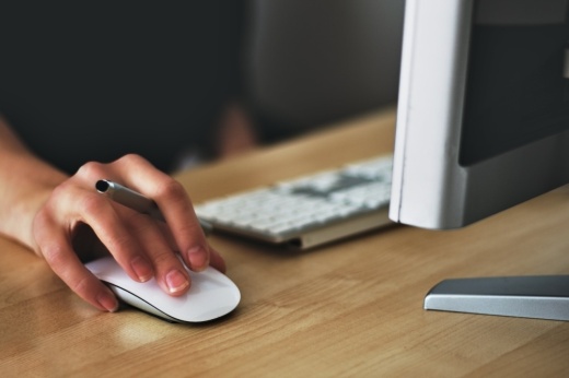 A photo of a person using a computer.