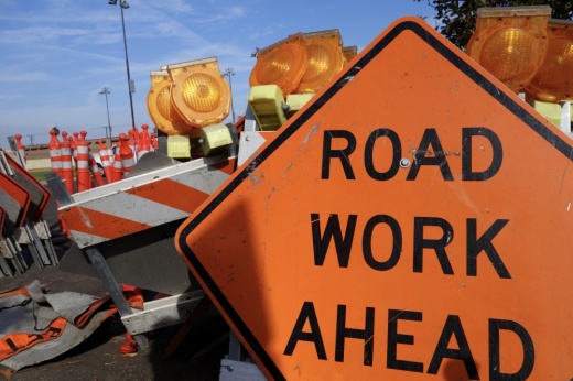 road work ahead sign on a road